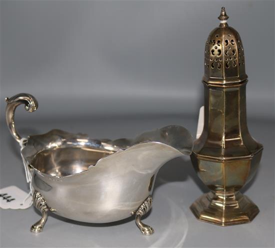 An Edwardian silver sauceboat by Edward Barnard & Sons Ltd, London, 1909 and a later silver sugar caster, 13.5 oz.